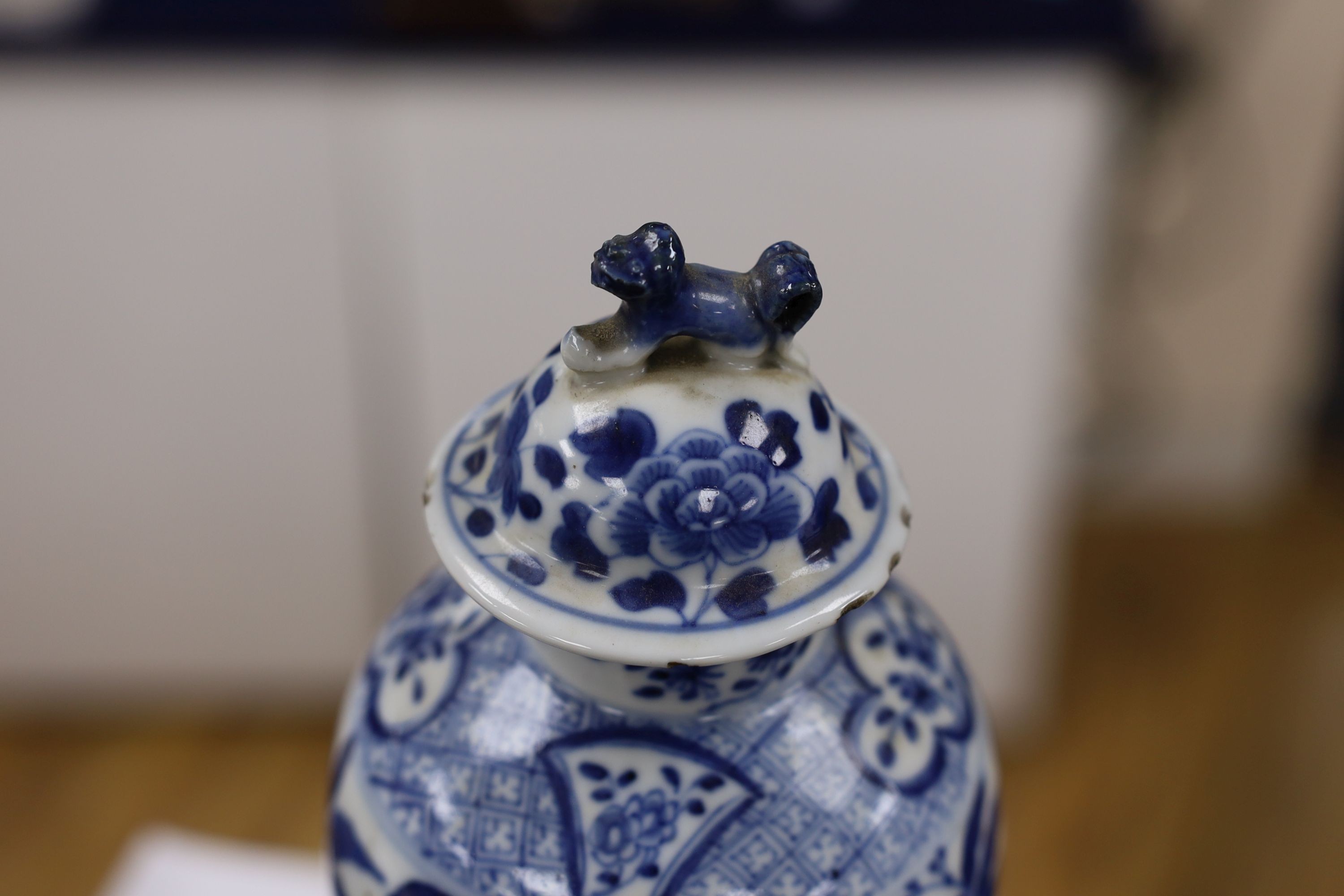 A pair of Chinese blue and white dragon vases and covers, circa 1900. 28cm